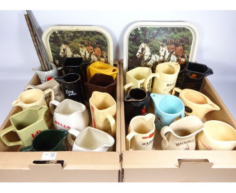 Collection of Wade whiskey jugs, other similar advertising jugs and three vintage beer serving trays etc in two boxes   Condi
