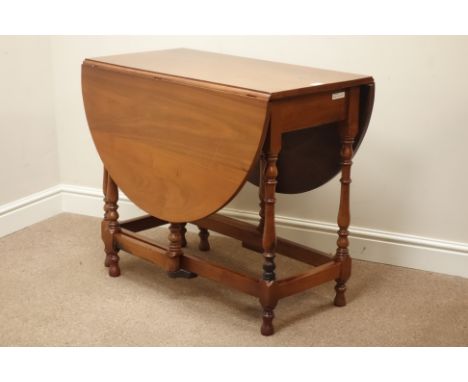 20th century walnut drop leaf table, on turned gate leg action base, 92cm x 134cm, H76cm   Condition Report   Click here for 