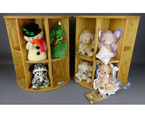 Two Merrythought Christmas teddies and five other small Merrythought bears on two wooden stands    Condition Report   Click h