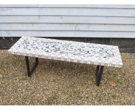 A mid 20th Century coffee table with mosaic ceramic and glass top and steel black finish legs.  144cm x 46cm x 44cm high