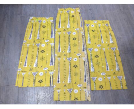 A small pair of curtains in 'Kite Strings' pattern by David Parsons for Heals in yellow colourway, each panel 92cm drop x 79c