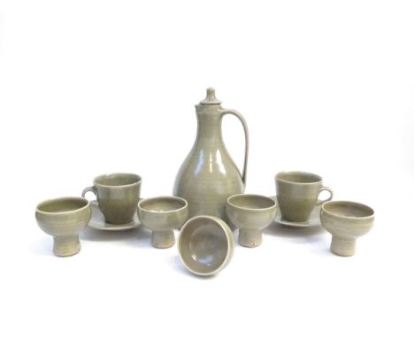 St Ives Leach Pottery - A green glazed stoneware wine ewer and stopper, 22cm high, together with five small pedestal cups, 6.