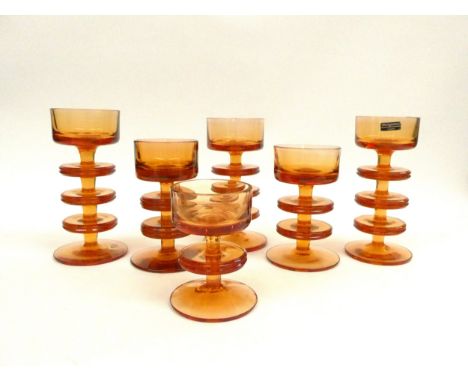 Six Wedgwood Sheringham candlesticks by Ronald Sennett-Willson in amber. One, two and three ring examples. Tallest 15.5cm