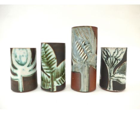 Four Briglin Pottery cylindrical vases, each with stylised foliate designs. Tallest 19.5cm