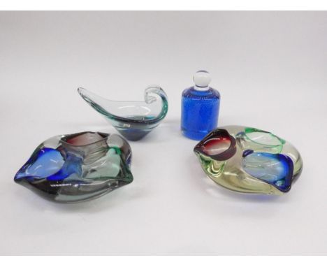 Two Murano style multicoloured art glass bowls, a Mdina set glass dish with original label and a blue art glass paperweight w