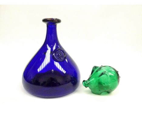 A Holmegaard 1960's cobalt bottle carafe by Ole Winther, 23cm high and a Jacob Bang green glass piggy bank for Holmegaard