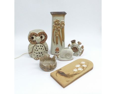 A collection of pottery including owl lamp, vase, snail money box etc. unmarked possibly Shelf Pottery and similar. Tallest 3