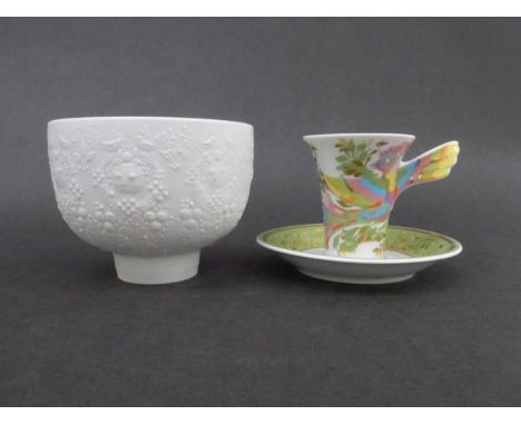 A Rosenthal porcelain "Mythos" Espresso cup and saucer by Bjorn Wiinblad, pinted in colours and enriched in gilt.  can 7.5cm 