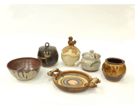 A collection of studio pottery to include Bernard Rooke lidded pot, Charlie Tustin pot, lidded canisters and dish etc. Talles