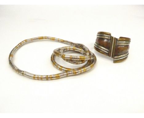 A mixed metal sculptural necklace or bracelet and mixed metal bangle