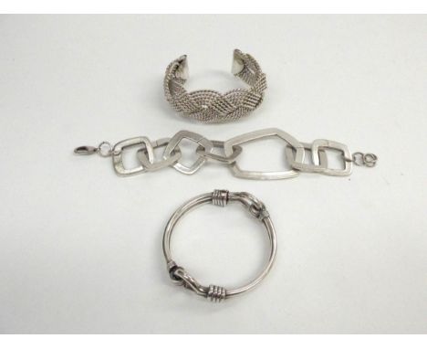 A silver bangle, woven cuff bracelet and square link bracelet