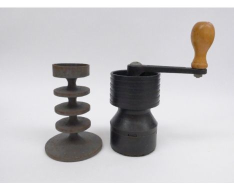 A Robert Welch cast iron coffee grinder for Salter and a 4 tier cast iron candle holder, moulded Robert Welch name. Tallest 2