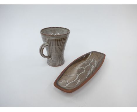 DAVID LEACH (1911-2005) A studio pottery mug with line detail, 10.5cm high (grazes to rim) and a long dish with tree design, 