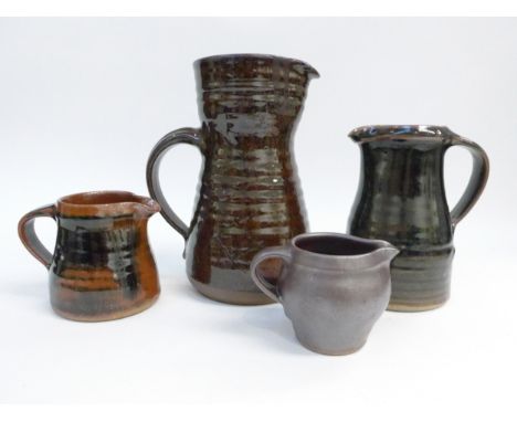 St Ives Leach Pottery - Four various jugs with tenmoku and similar glazes. Impressed Pottery seals only.  Tallest 21cm.  (chi
