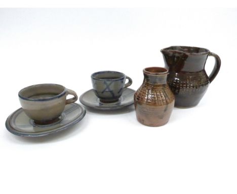 A collection of Abuja Pottery including a Gugong Bong small jug, 10.5cm high, Tanko Mohammed vase 8.7cm high, plus two cups a