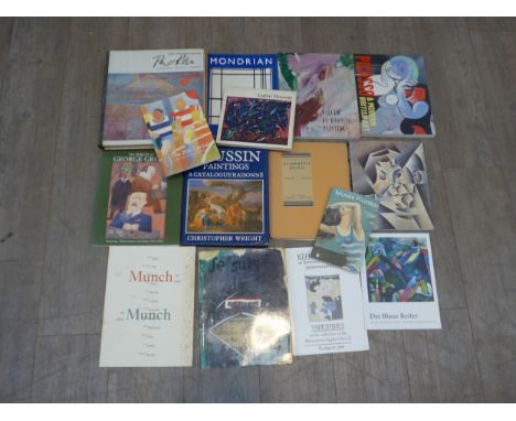 A collection of art books including Pablo Picasso , Juan Gris , Willem de Kooning etc