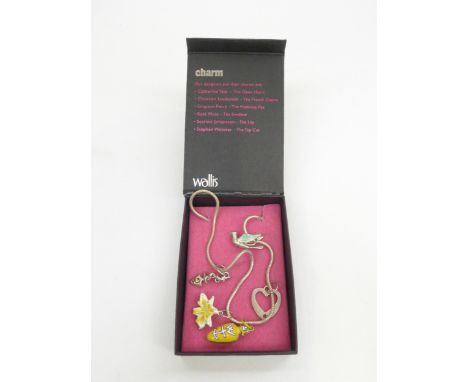 A Grayson Perry costume jewellery charm bracelet including Grayson Perry charm in original box