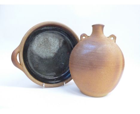 A Muchelney Pottery stoneware bottle flask and twin handled ovenware dish. Flask 22cm high, dish 27cm diameter (including han