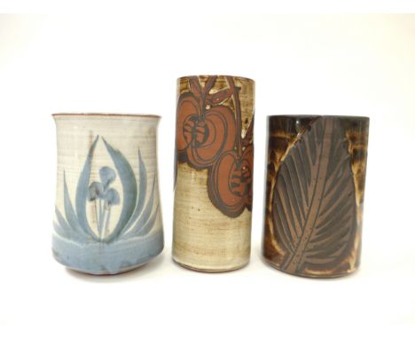 Three Briglin Pottery cylindrical vases, each with foliate designs, painted or etched. Tallest 19cm