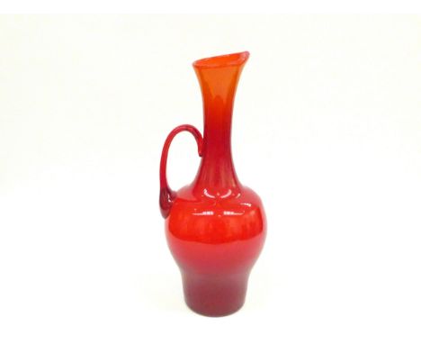 Attributed to Zebigniew Horobowy a red art glass pitcher with single handle. Polished pontil 37.5cm high