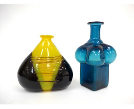 Two art glass vases including a blue bottle vase in the manner of Bertil Vallien and a yellow and amethyst shoulder vase. Bot