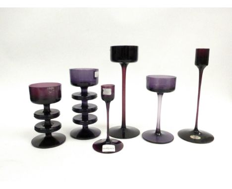 A collection of Wedgwood amethyst candlesticks by Ronald Sennett-Willson. Three and Two ring Sheringham, Brancaster, incl one
