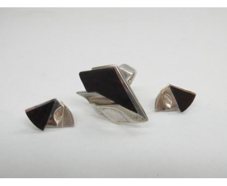 A Lapponia sterling silver and ebony ring and matching earrings designed by Zoltan Popovits , made in Finland.