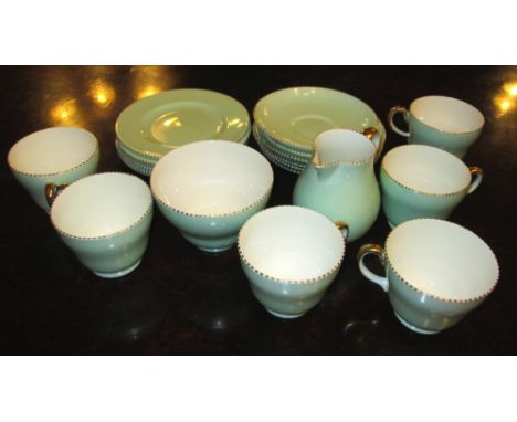 WEDGWOOD TEA SERVICE, Celadon colour ground with gilt rim, six teacups and saucers, one sugar bowl, cream jug and six side pl