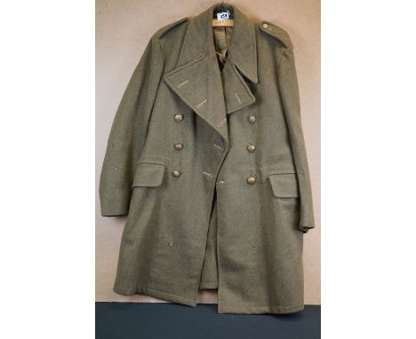 A British Army World War Two Great Coat With Brass Buttons, Dated 1943 
