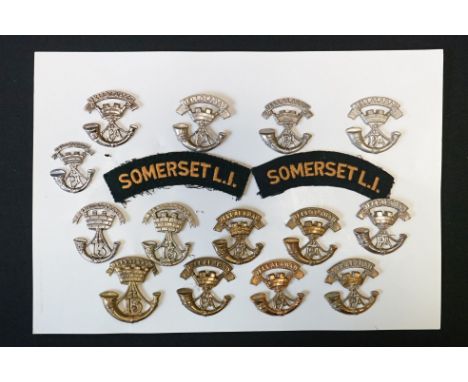 A Collection Of Fourteen Somerset Light Infantry Regimental Cap Badges Together With Two Somerset Light Infantry Cloth Should