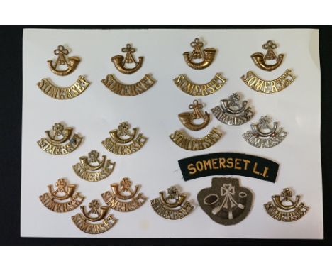 A Collection Of Seventeen The Somerset Light Infantry Regimental Badges To Include Cap Badges, Collar Badges And Shoulder Tit