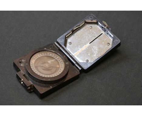 A British Military Issued Mark 1 Magnetic Marching Compass By T.G.Co. Ltd, Marked With The British Broad Arrow. 