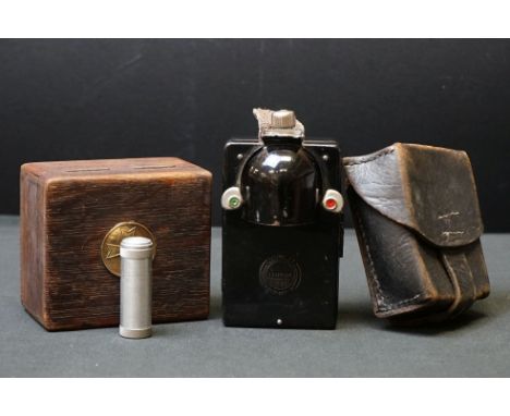 A Small Group Of World War Two German Collectables To Include A Small Wooden Box Containing A Trench Lighter, Leather Ammo Po