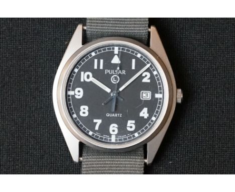 A British Military Issued G10 Pulsar Watch, Marked To Verso 6645-99 6052627 P10781/01 Together With The British Broad Arrow, 