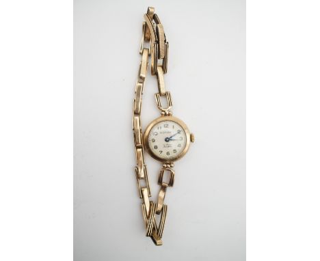 A lady's vintage 9ct gold cased Rotary wrist watch on a 9ct gold flexible bracelet strap, with 17 jewel Incabloc movement, ci
