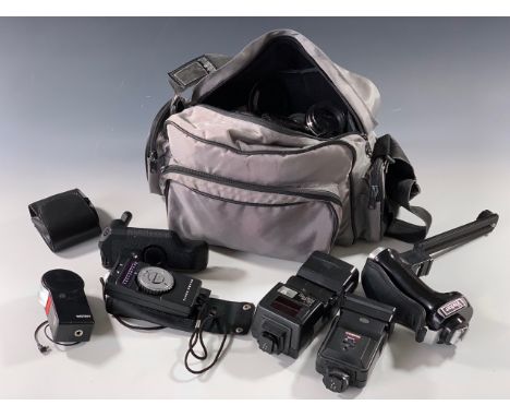 A camera bag containing a number of filters, Starblitz 300 DFC flash gun, Cobra MD210 flash gun, Wotan SC18 flash gun, Vivita