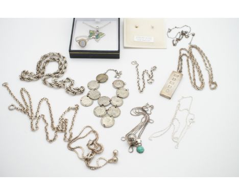 A quantity of vintage silver and white-metal jewellery, including an ingot pendant, neck chains and a 3d coin bracelet, appro