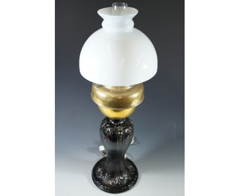 A composite oil lamp on cast brass base, converted to electricity