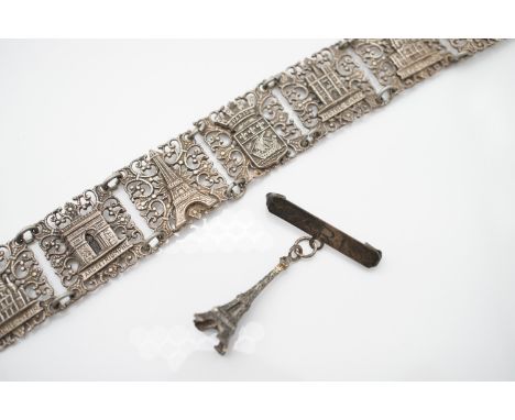 A vintage electroplate 'Paris' souvenir pendant brooch and bracelet, the latter comprising eight filigree plaques faced with 