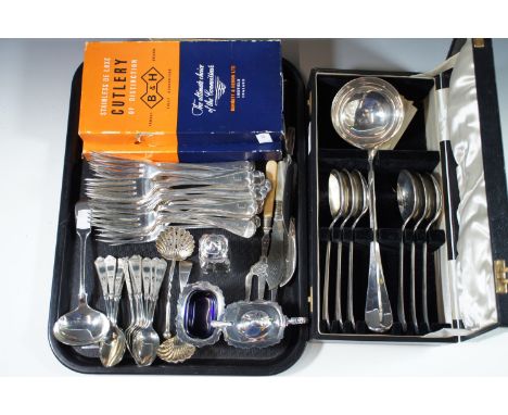 Two boxes of Bennett and Heron table knives, twelve teaspoons, cased ladle and spoons, forks and electroplate condiments