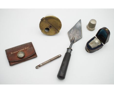 Sundry collectables including Victorian miniature trowel, thimbles and case, patent ink well etc.