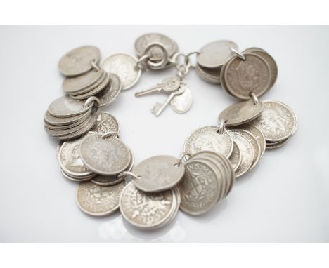 A vintage "silver" three pence coin bracelet, containing Victorian - George V examples, 84.5g