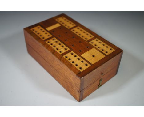 A parquetry folding cribbage board and De La Rue playing cards