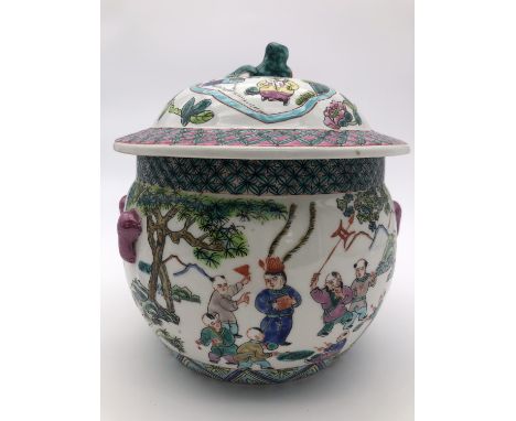 A Chinese famille vert covered jar, polychrome enamelled with figures playing instruments, 23 cm high 