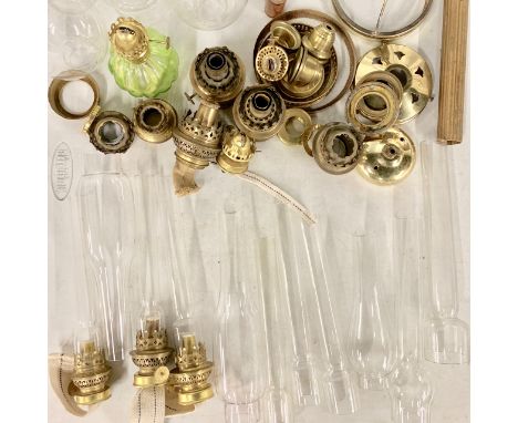 A large quantity of oil lamp burners, funnels etc