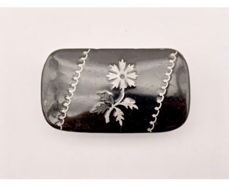 A Victorian pewter inlaid lacquered snuff box