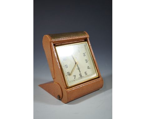 A Smiths travel alarm clock, presented to H. Rycroft, by the Directors of Ferguson Bros Ltd.
