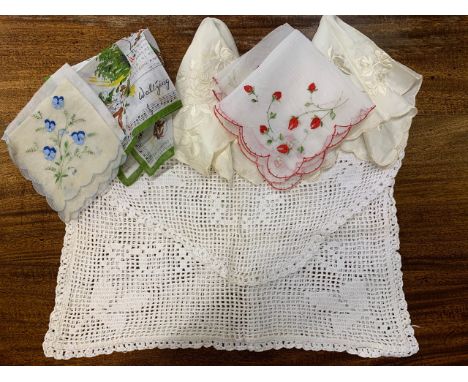 Vintage textiles including a St Neot's crochet work pyjama envelope, and printed and embroidered handkerchiefs  