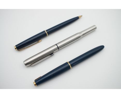 A vintage Parker fountain pen, and a Parker pen and pencil set