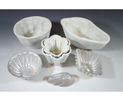 Two Shelley jelly moulds, two other ceramic and three enamel moulds